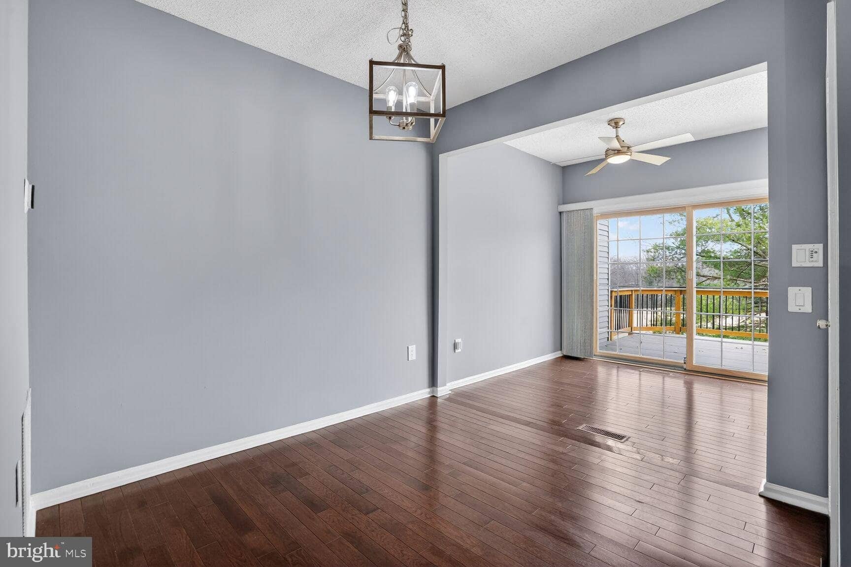 Dining area opening toward the rear deck and kitchen