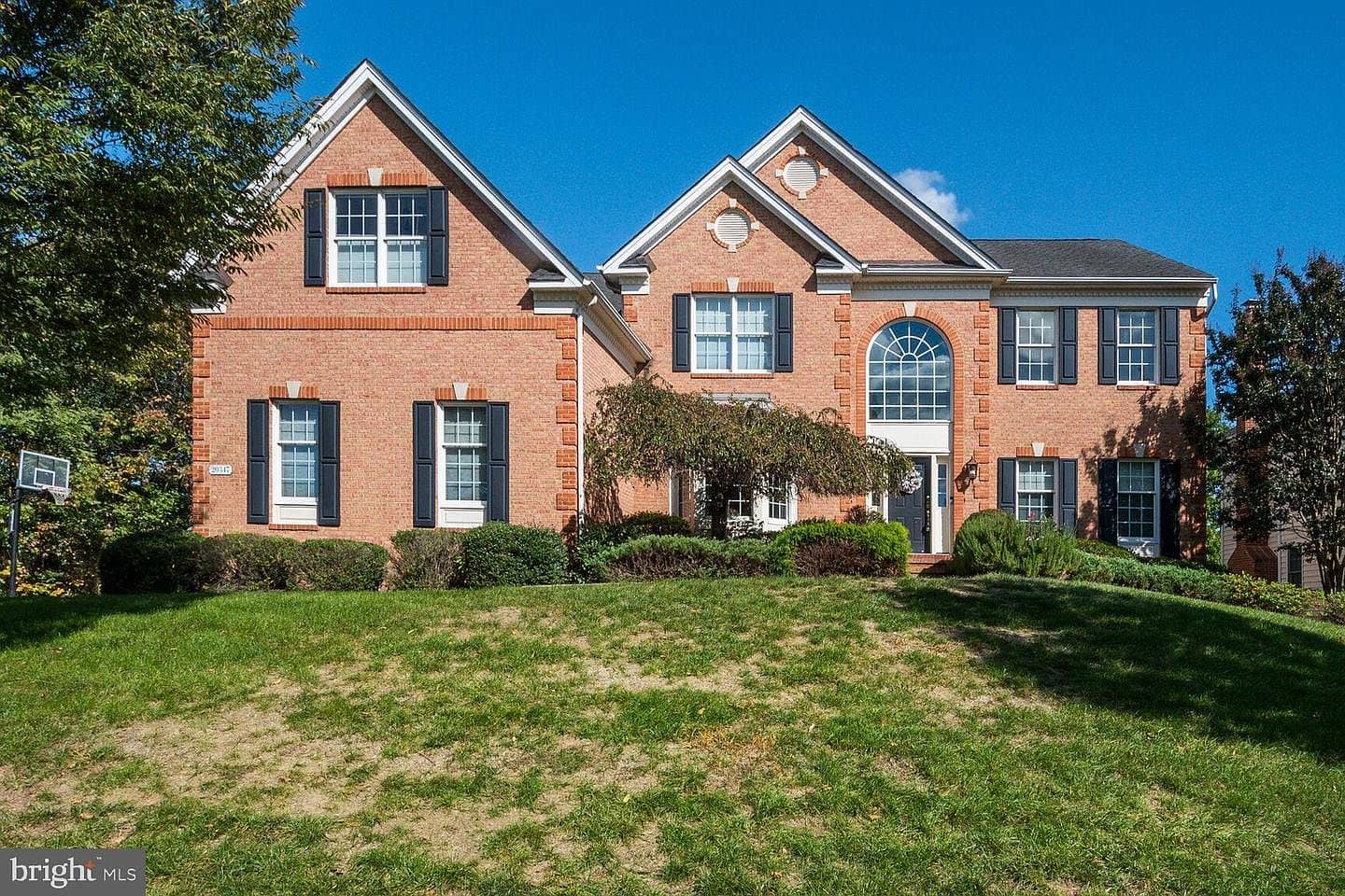 Wide front view of 20347 Kiawah Island Drive and its landscaped lawn