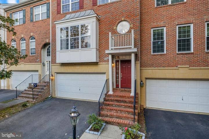 Brick front exterior with bay window, red entry door, and garage at 2969 Kildare Lane