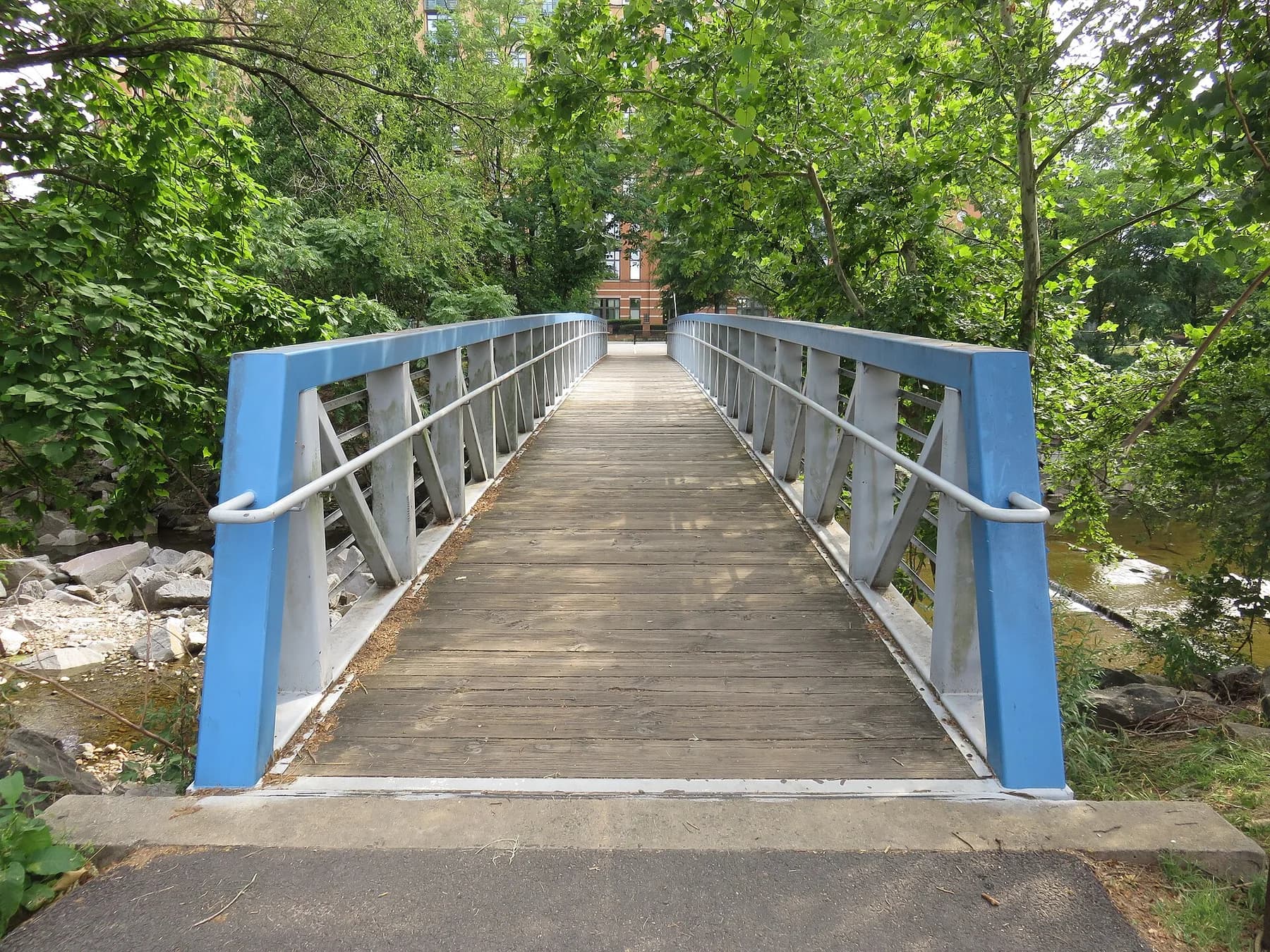 A leafy footbridge across Four Mile Run at Jennie Dean Park in Arlington