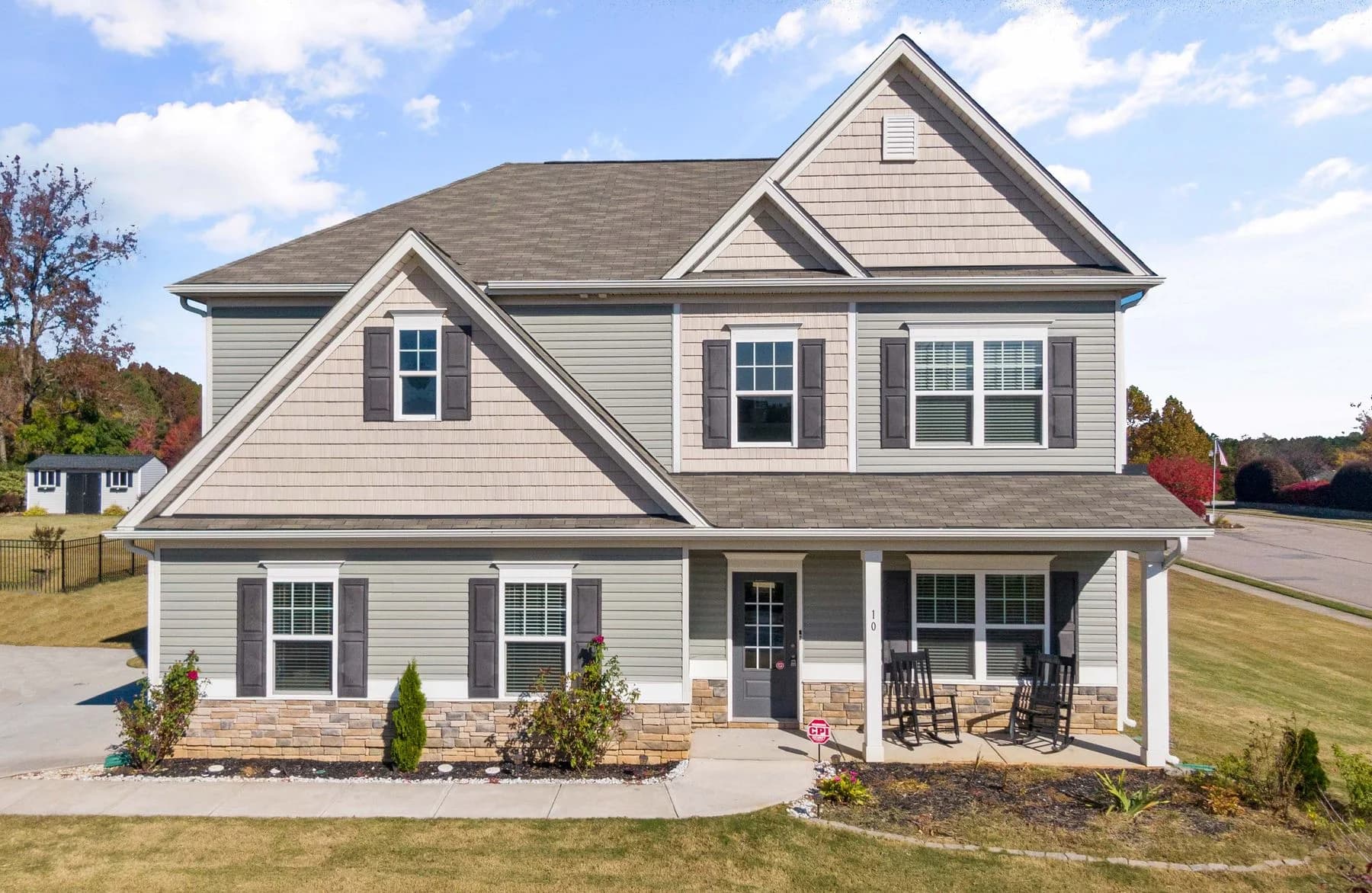 Gabled two-story house with a full-width front porch — architectural inspiration