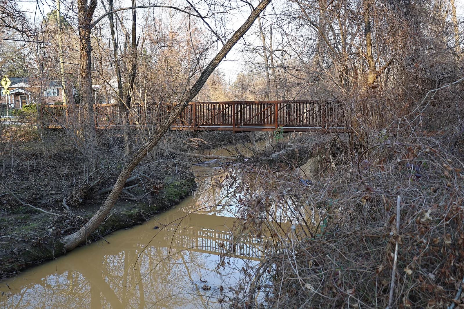 Wooden footbridge over a creek in Van Dyck Park, Fairfax City